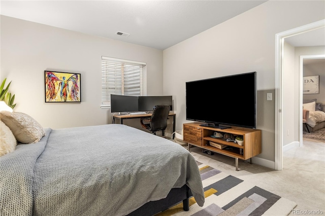 bedroom with light carpet, visible vents, and baseboards