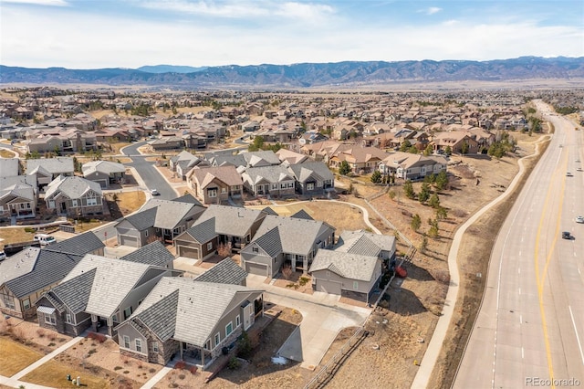 drone / aerial view featuring a mountain view and a residential view