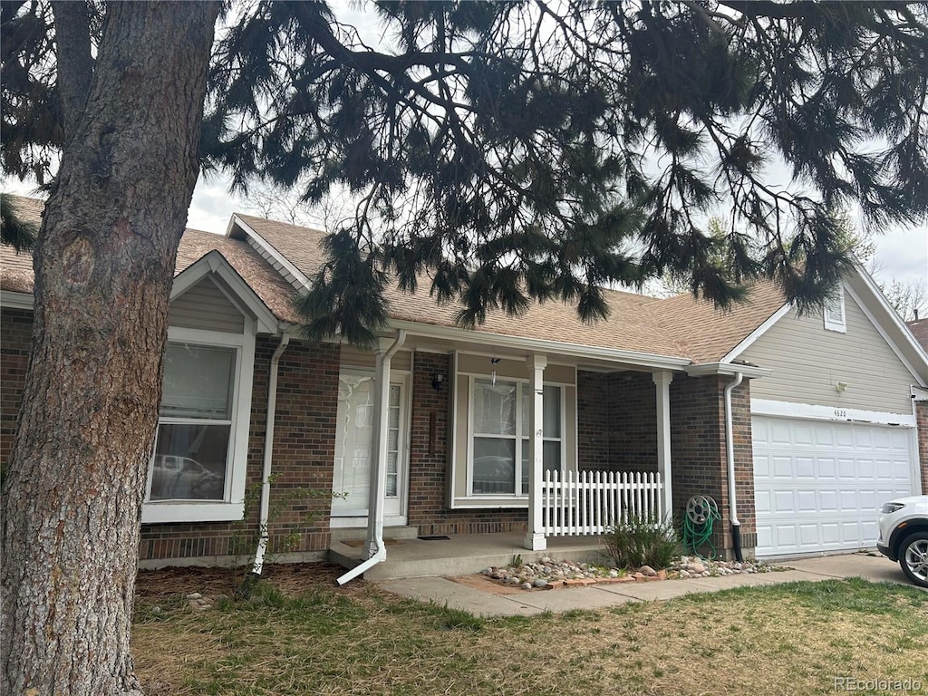 view of front facade with a garage and covered porch