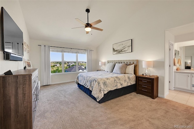 bedroom featuring lofted ceiling, a ceiling fan, connected bathroom, baseboards, and light colored carpet