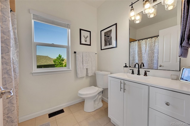 bathroom featuring tile patterned flooring, visible vents, baseboards, toilet, and vanity