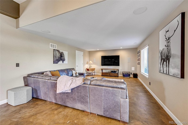 living room featuring recessed lighting, finished concrete flooring, visible vents, and baseboards