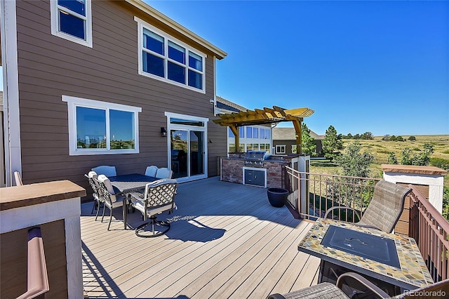 deck featuring outdoor dining space, area for grilling, a pergola, and a grill