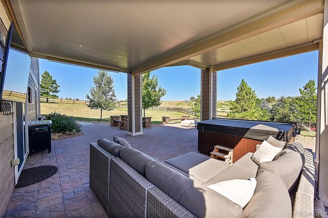 view of patio / terrace featuring outdoor lounge area and a hot tub