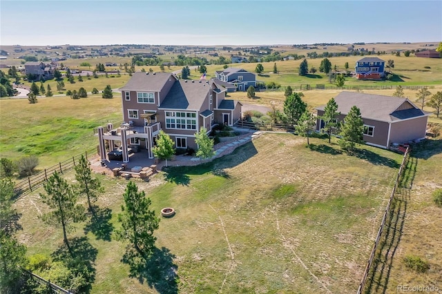 birds eye view of property featuring a rural view