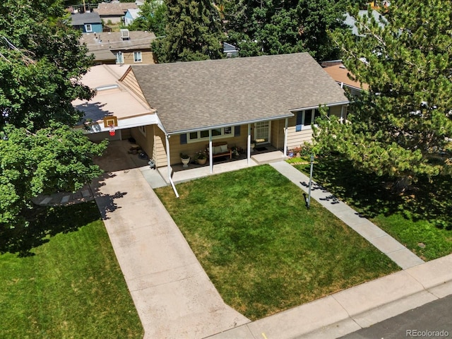 1827 S Fairfax St, Denver, CO 80222 - view of front facade featuring roof with shingles, driveway, and a front yard