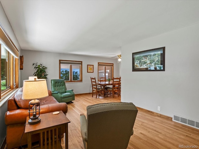 1827 S Fairfax St, Denver, CO 80222 - living room featuring light wood-type flooring and ceiling fan