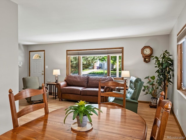 1827 S Fairfax St, Denver, CO 80222 - dining area with light wood-type flooring and baseboards