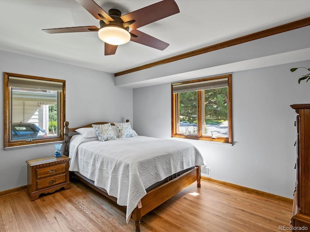 1827 S Fairfax St, Denver, CO 80222 - bedroom with multiple windows, light wood finished floors, and a ceiling fan