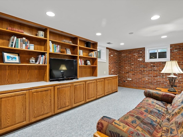 1827 S Fairfax St, Denver, CO 80222 - living area featuring brick wall, carpet, and recessed lighting