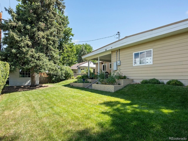 1827 S Fairfax St, Denver, CO 80222 - view of yard featuring a vegetable garden