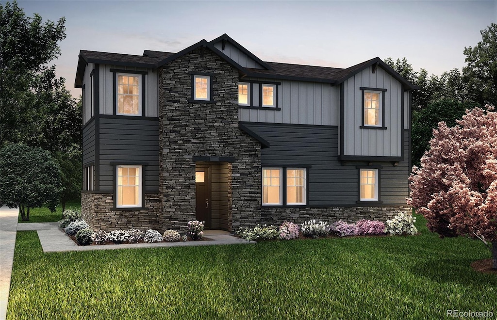 view of front of property featuring a front lawn and board and batten siding