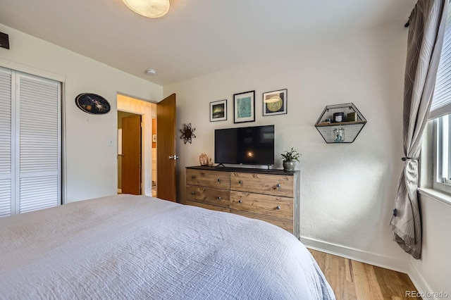 6995 W 27th Ave, Wheat Ridge, CO 80033 - bedroom featuring wood finished floors and a closet