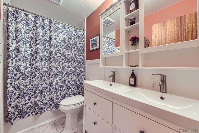 6995 W 27th Ave, Wheat Ridge, CO 80033 - bathroom featuring double vanity, tile patterned flooring, and a shower with curtain