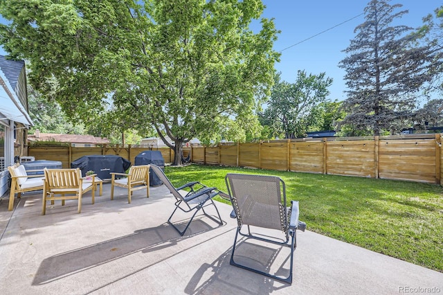 6995 W 27th Ave, Wheat Ridge, CO 80033 - fenced backyard with a patio and grilling area