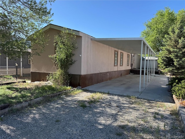 934 Elm Dr, Salida, CO 81201 - view of side of property with a carport