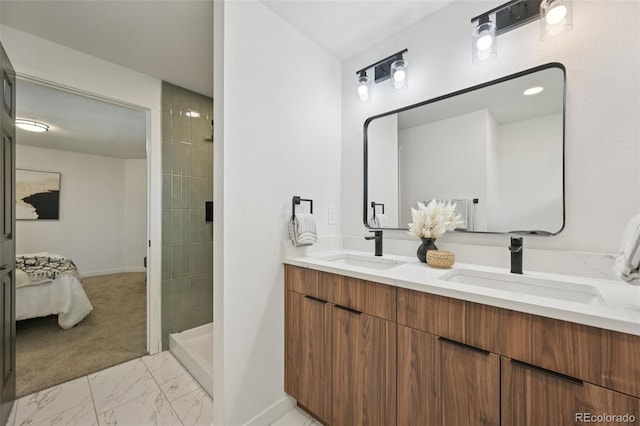 169 Yates St, Denver, CO 80219 - bathroom with double vanity, marble finish floors, connected bathroom, and tiled shower