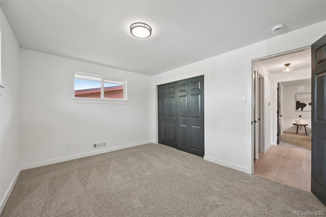 169 Yates St, Denver, CO 80219 - unfurnished bedroom with light colored carpet and a closet
