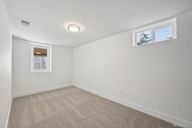 169 Yates St, Denver, CO 80219 - carpeted empty room featuring baseboards