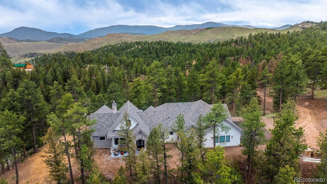 31455 Half Peak Trl, Pine, CO 80470 - aerial view of property and surrounding area with a forest and a mountainous background