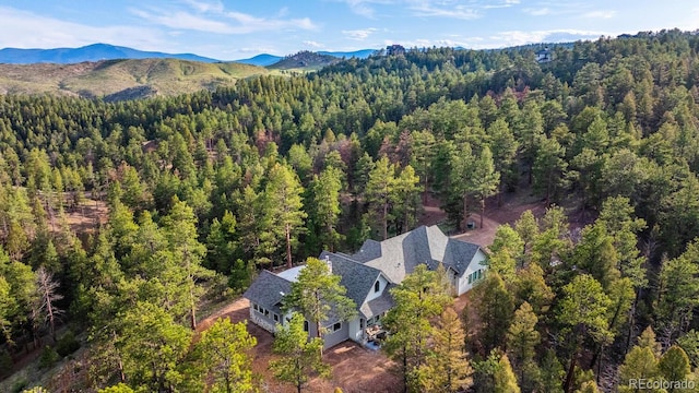 31455 Half Peak Trl, Pine, CO 80470 - view from above of property featuring a heavily wooded area and a mountainous background