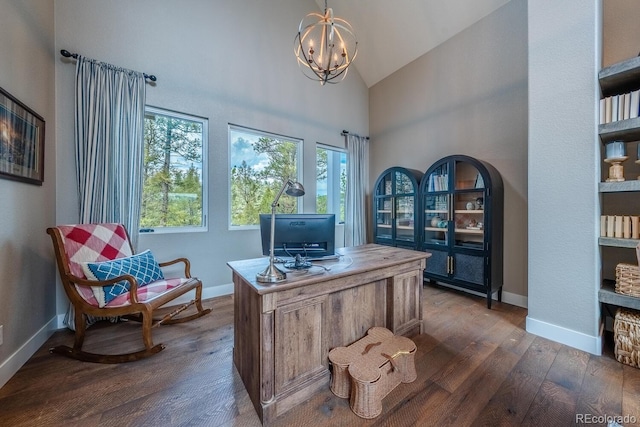 31455 Half Peak Trl, Pine, CO 80470 - home office with dark wood finished floors, plenty of natural light, baseboards, a chandelier, and high vaulted ceiling