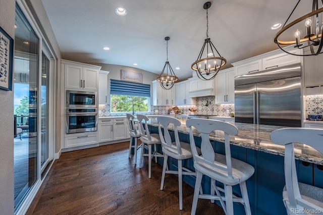 31455 Half Peak Trl, Pine, CO 80470 - kitchen featuring built in appliances, a chandelier, tasteful backsplash, white cabinetry, and recessed lighting
