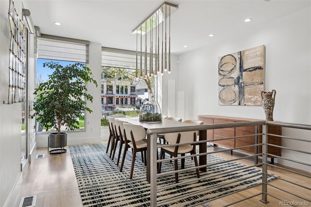 dining space featuring visible vents, recessed lighting, baseboards, and wood finished floors