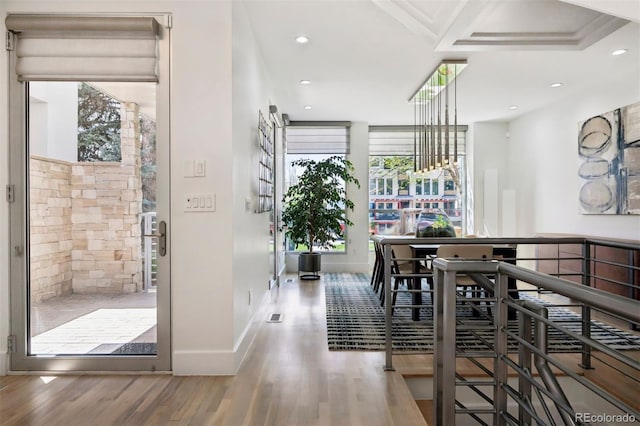 dining room featuring recessed lighting, baseboards, visible vents, and wood finished floors