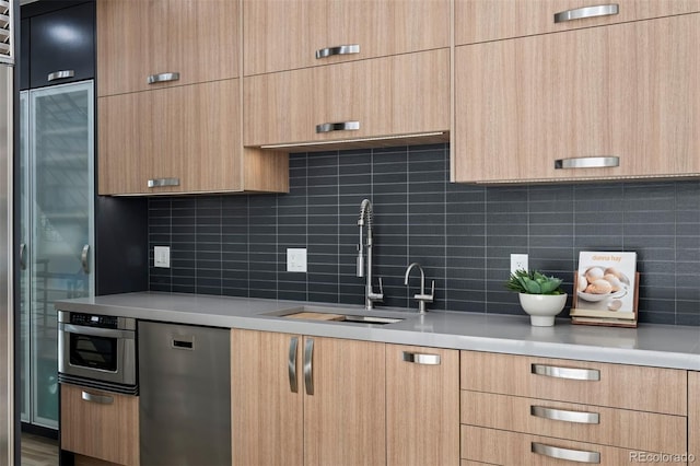 kitchen featuring light countertops, a sink, and modern cabinets