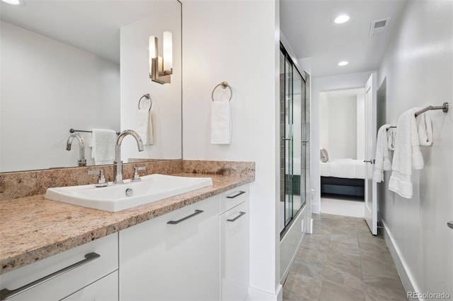 full bathroom with visible vents, baseboards, ensuite bathroom, recessed lighting, and a shower with shower door