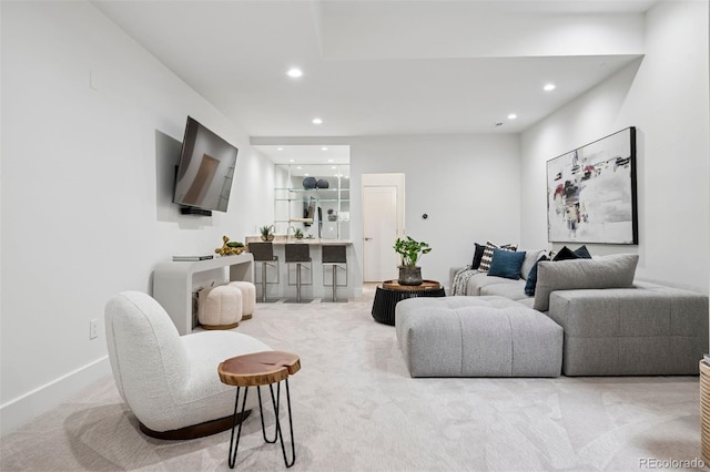 living room featuring recessed lighting, carpet, and baseboards