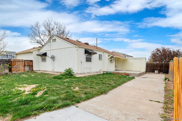 12116 N Fairfax St, Thornton, CO 80241 - rear view of property featuring a lawn and a fenced backyard