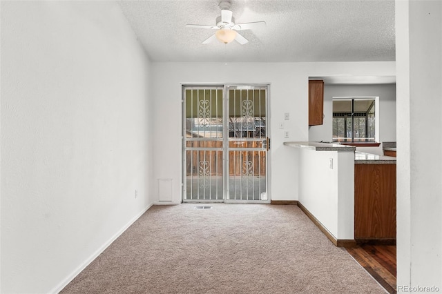12116 N Fairfax St, Thornton, CO 80241 - interior space with carpet, a textured ceiling, baseboards, and ceiling fan