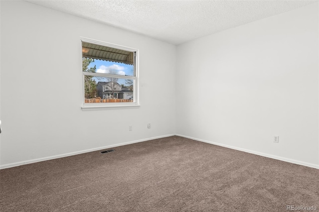 12116 N Fairfax St, Thornton, CO 80241 - spare room with carpet flooring, a textured ceiling, visible vents, and baseboards