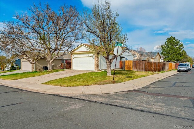 12116 N Fairfax St, Thornton, CO 80241 - view of front of property with an attached garage, fence, driveway, and a front yard