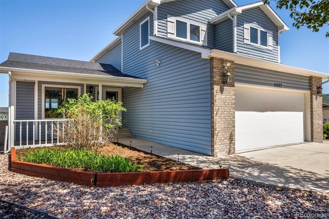 11577 Cranston Dr, Peyton, CO 80831 - view of home's exterior featuring an attached garage, brick siding, and concrete driveway