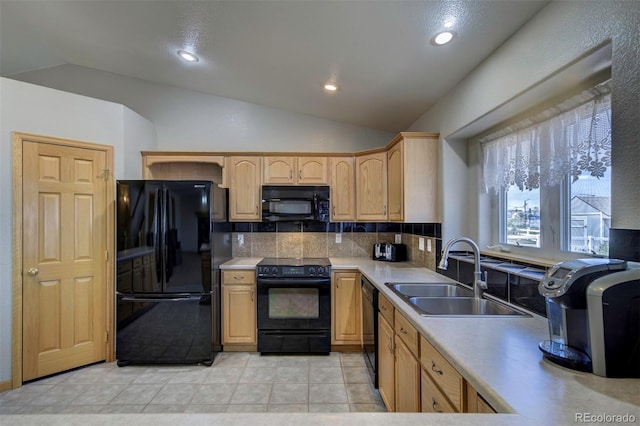 11577 Cranston Dr, Peyton, CO 80831 - kitchen with black appliances, a sink, lofted ceiling, tasteful backsplash, and light countertops