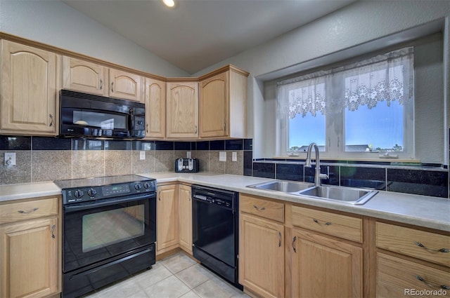 11577 Cranston Dr, Peyton, CO 80831 - kitchen featuring black appliances, light brown cabinetry, a sink, lofted ceiling, and tasteful backsplash