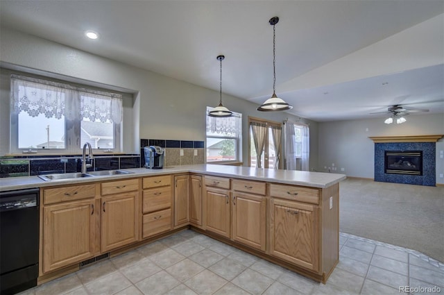 11577 Cranston Dr, Peyton, CO 80831 - kitchen with a sink, black dishwasher, vaulted ceiling, healthy amount of natural light, and light countertops