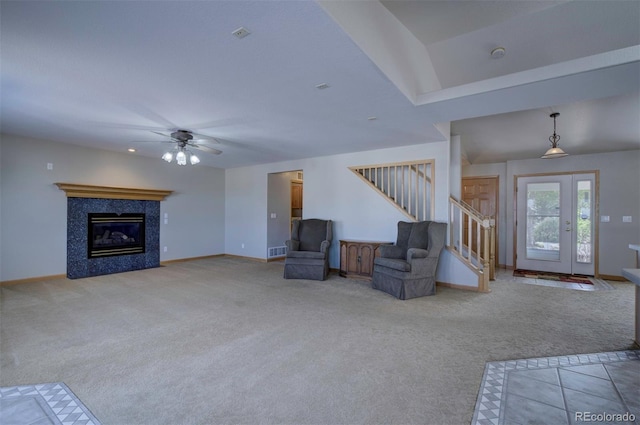 11577 Cranston Dr, Peyton, CO 80831 - unfurnished living room with stairs, light carpet, baseboards, and ceiling fan