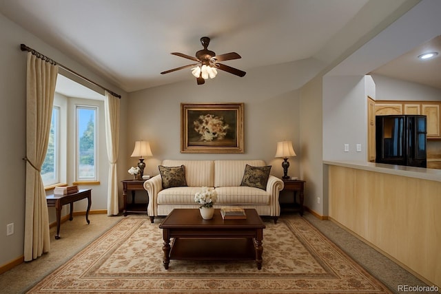 11577 Cranston Dr, Peyton, CO 80831 - living area with lofted ceiling, ceiling fan, and light carpet