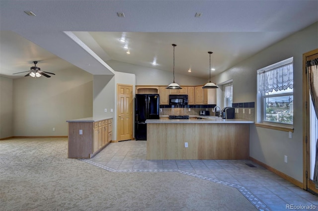 11577 Cranston Dr, Peyton, CO 80831 - kitchen with black appliances, a peninsula, open floor plan, light countertops, and vaulted ceiling