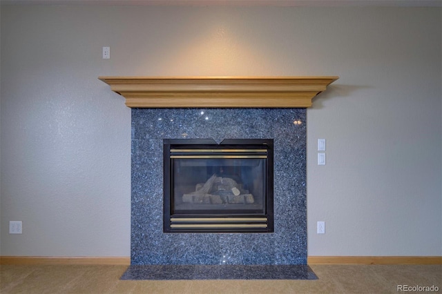11577 Cranston Dr, Peyton, CO 80831 - detailed view of carpet floors and a premium fireplace
