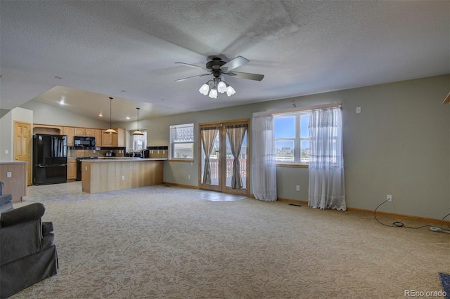 11577 Cranston Dr, Peyton, CO 80831 - unfurnished living room with a ceiling fan, lofted ceiling, a textured ceiling, and light colored carpet