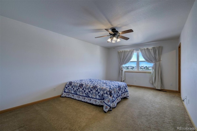 11577 Cranston Dr, Peyton, CO 80831 - carpeted bedroom with a ceiling fan and baseboards
