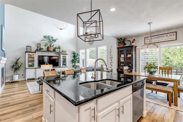21658 E Tallkid Ave, Parker, CO 80138 - kitchen featuring dishwasher, a center island with sink, light wood-type flooring, white cabinets, and recessed lighting
