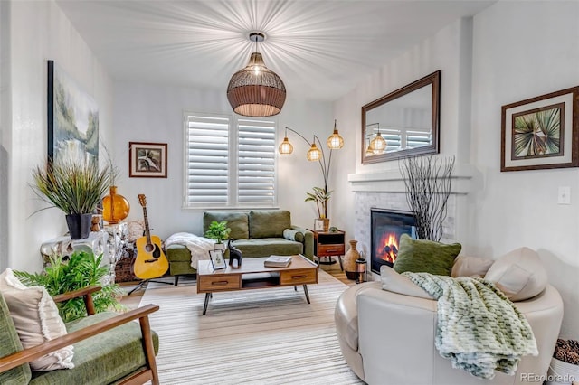 21658 E Tallkid Ave, Parker, CO 80138 - living area with a glass covered fireplace and light wood-style flooring