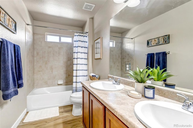21658 E Tallkid Ave, Parker, CO 80138 - full bath featuring double vanity, shower / bathtub combination with curtain, and wood finished floors