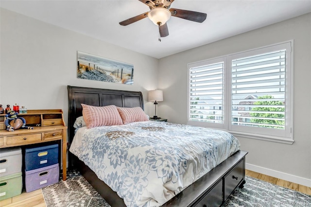 21658 E Tallkid Ave, Parker, CO 80138 - bedroom with light wood-style flooring and a ceiling fan